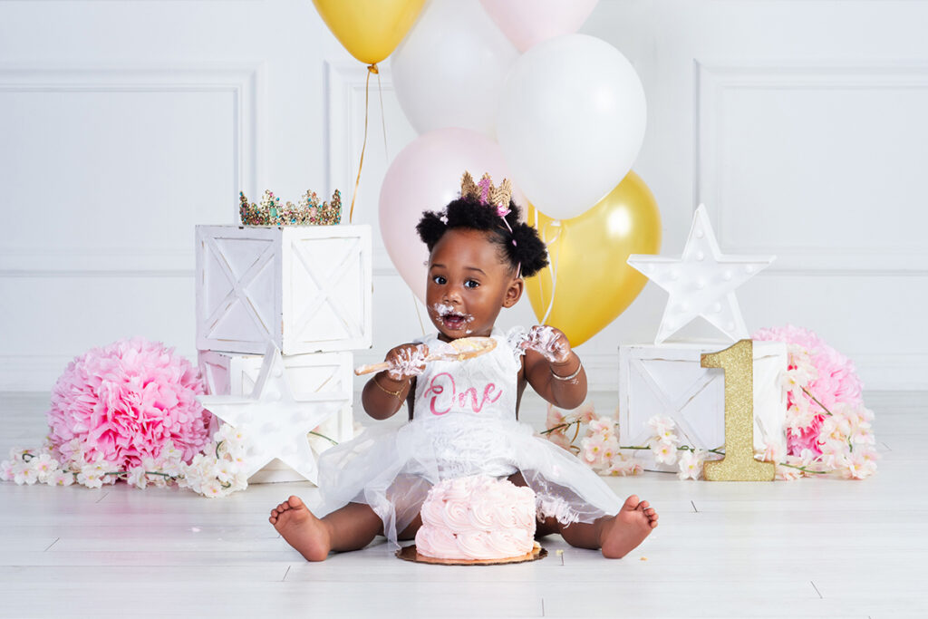 First birthday photo of baby in studio with balloons and smash cake – Cloud 9 Studios in Wesley Chapel