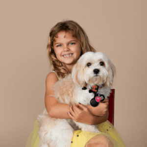 portrait of a girl hugging her dog with a sweet embrace at Cloud 9 Studios in Wesley Chapel, Florida