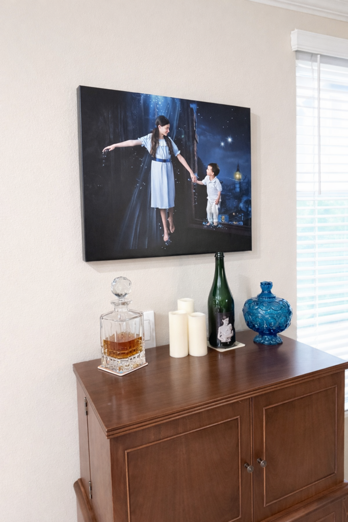 Canvas wall art of two children in a Neverland-inspired imagination portrait displayed in a family home in Wesley Chapel, Florida
