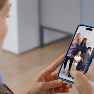 Mom scrolling through phone photos looking for a family photo