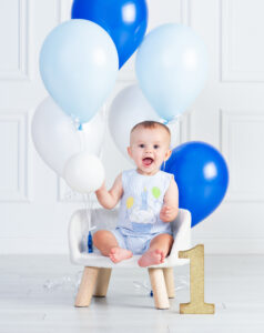 One year old child laughing during first birthday portrait experience Wesley Chapel Florida