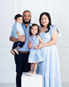 Family together during a family portrait session at Cloud 9 Studios in Wesley Chapel