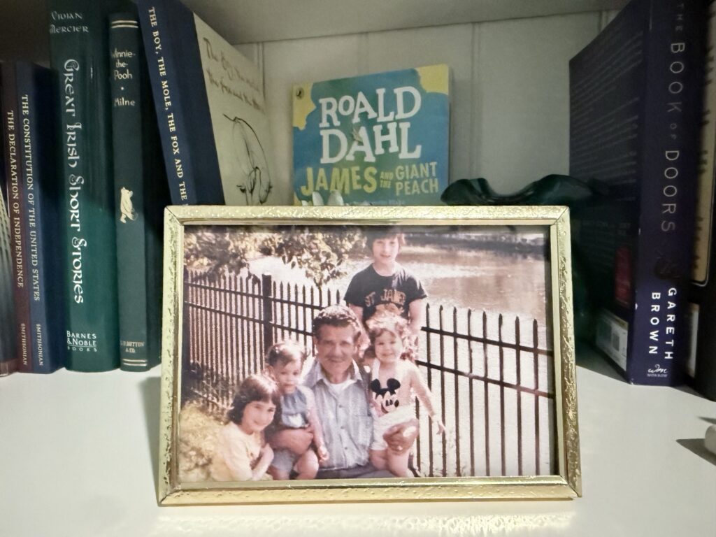 Jeanine as a young child with her maternal grandfather and cousins together in a park.